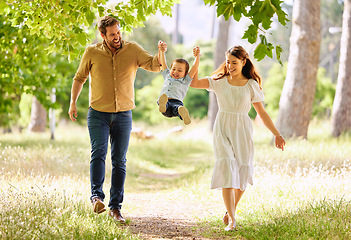 Image showing When hes happy, were happy. a family taking a walk in the park.