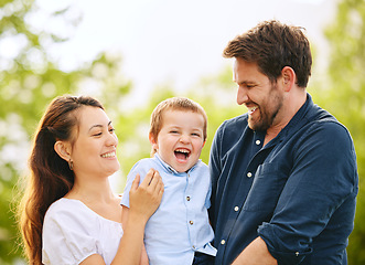 Image showing Hes such a joy. a young family spending time together at the park.