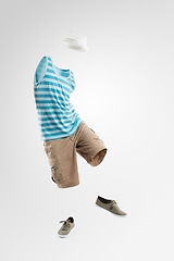 Image showing Just call me Mr Incognito. Studio shot of an invisible man dancing against a grey background.