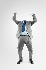 Image showing Now the world will know my name. Studio shot of an invisible businessman cheering against a grey background.