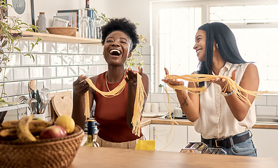 Image showing Tastiness in hand. two young friends cooking together at home.