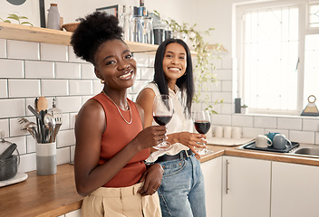 Image showing Its a wine type of day. two young friends drinking wine together at home.