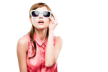 Image showing Say hello to the sexy sixties. Studio shot of an attractive young woman dressed up in 60’s wear against a white background.