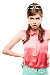 Image showing What do you mean the sixties are over. Studio shot of an attractive young woman dressed up in 60’s wear against a white background.