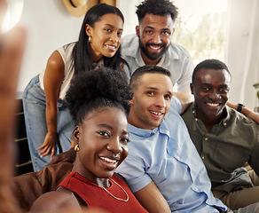 Image showing This is the people who made my childhood a blast. a woman taking a selfie with a group of friends at home.