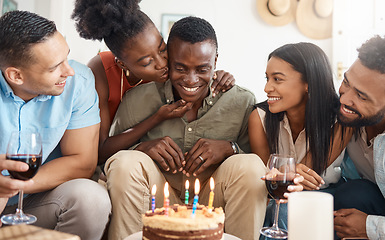 Image showing May all your wishes come true. a young man celebrating his birthday with friends at home.