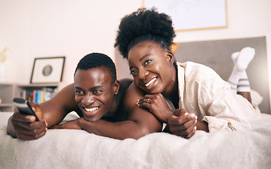 Image showing Bonding over series. a young couple watching tv together at home.