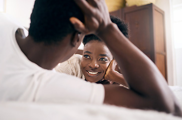 Image showing We stare at each other for hours. a young couple relaxing together at home.