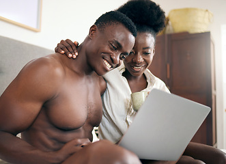 Image showing One episode to start the day. a young couple using a laptop together at home.