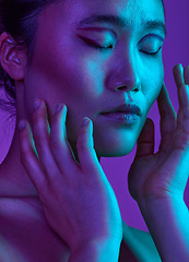 Image showing Jealousy is music to my ears, get my dancing shoes. an attractive young woman posing in studio against a purple background.