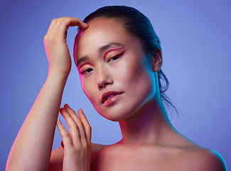 Image showing Young looks are so precious. an attractive young woman posing in studio against a purple background.