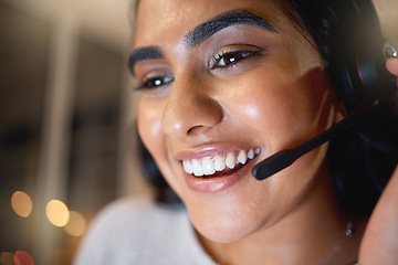 Image showing Happy and helpful. an attractive young businesswoman working late at her company offices.