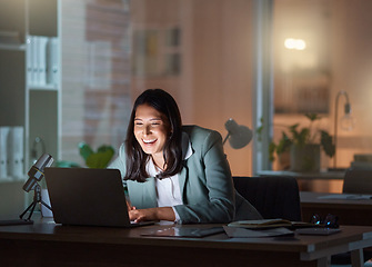 Image showing On that late night grind. an attractive young businesswoman working late at her company offices.