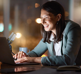 Image showing Having a great time on the grind. an attractive young businesswoman working late at her company offices.