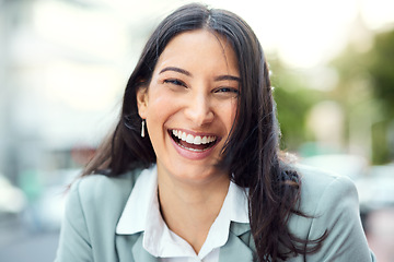 Image showing When youre smiling, life is vibing. Portrait of a confident young businesswoman standing against an urban background.