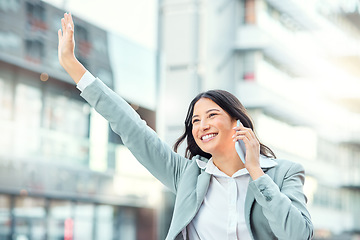 Image showing Build the tomorrow you deserve with the opportunities of today. a young businesswoman using a smartphone and gesturing to order a cab against an urban background.