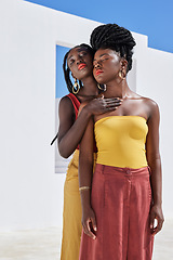 Image showing Let your beauty shine bright. two attractive young women posing on a rooftop outdoors.