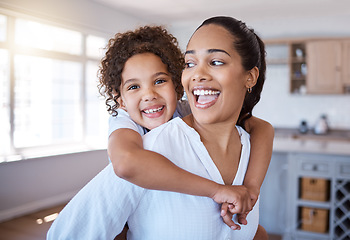 Image showing Happiness is mother and daughter time. Portrait of a little girl bonding with her mother at home.