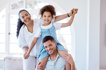 Image showing Fun is vital in our family. Portrait of a little girl bonding with her parents at home.