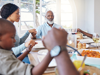 Image showing You always know who to turn to. a beautiful family blessing the food with a prayer at the table together at home.