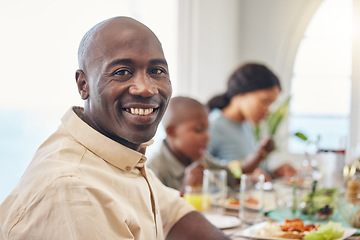 Image showing Enjoying family time at dinners and meals at Thanksgiving. a man having lunch with his family.