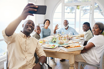 Image showing Family meals provide an opportunity for family to come together. a family taking a selfie while having lunch at home.