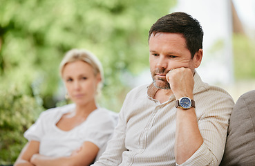 Image showing Sad man looking disappointed and ignoring wife after argument. Middle aged man thinking about divorce after fight and having relationship troubles