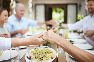 Image showing Heres a few of the things were thankful for today. a family saying grace while sitting together at the dining table.