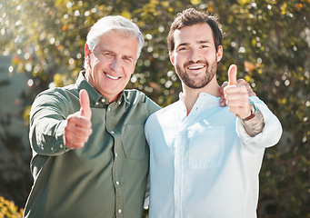 Image showing Youve got our support. Cropped portrait of a handsome young man and his father gesturing thumbs up outdoors.