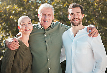 Image showing Spending time with the men in her life. Cropped portrait of a handsome mature man standing outside with his daughter and son-in-law.