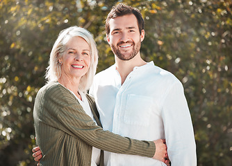 Image showing All grown up but still my little boy. Cropped portrait of a handsome young man and his mother outdoors.