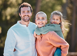 Image showing Its play-hour at the park. a young couple and their daughter spending time outdoors.