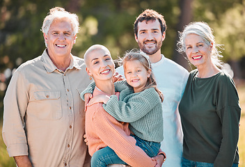 Image showing This is my clan. a multi-generational family posing together outdoors.