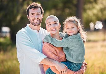 Image showing Theyre such a beautiful family. a young couple and their daughter spending time outdoors.