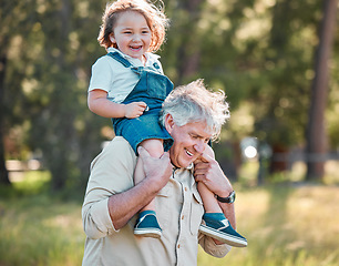 Image showing Grandpa has the best stories and the best adventures. a senior man carrying his grandson on his shoulders.