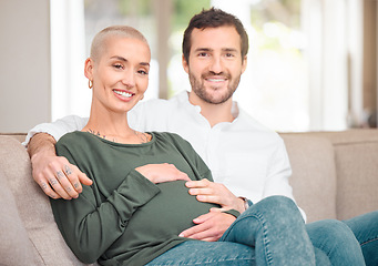 Image showing Were expecting. Cropped portrait of an affectionate young expectant couple sitting on the sofa at home.