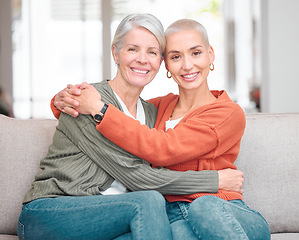 Image showing My daughter grew up to become my best friend. Cropped portrait of an attractive young woman and her senior mother sitting on the sofa at home.