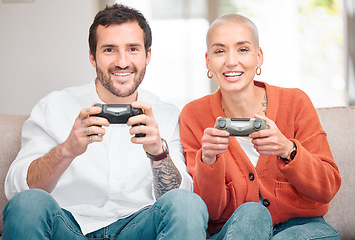 Image showing A couple that plays together, stays together. Cropped portrait of an affectionate young couple playing video games at home.