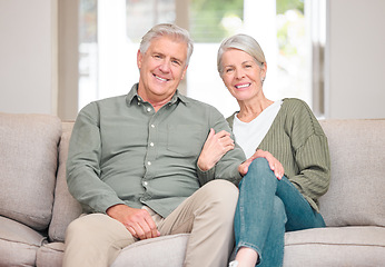 Image showing Were loving our retirement. Cropped portrait of an affectionate senior couple sitting on the sofa at home.