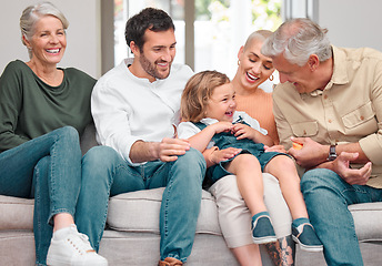 Image showing Grandpa brings the giggles. a happy family bonding on the sofa at home.