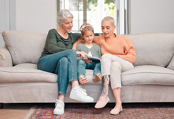 Image showing At ease with mom. a mature woman bonding with her daughter and granddaughter while using a digital tablet.