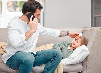 Image showing The world stops at the feet of a sick child. a father calling the doctor for his sick daughter using his smartphone.