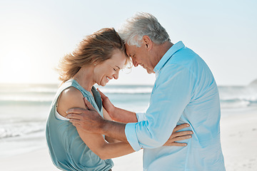 Image showing Let love do its magic. a mature couple spending time together at the beach.