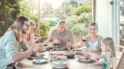 Image showing Family lunches are our thing. a family sitting together and enjoying lunch.