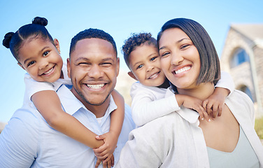 Image showing Their happiness is our duty. a beautiful young family bonding outside.