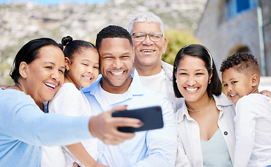 Image showing Everyone, squeeze in. a beautiful family taking a selfie together while bonding outside.