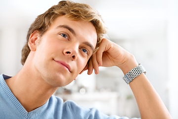 Image showing Dreaming of the days ahead. a young man day dreaming while relaxing at home.