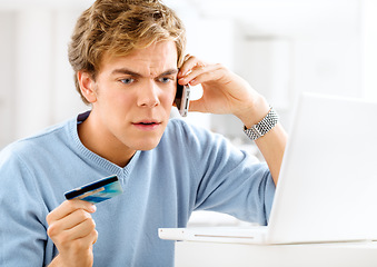 Image showing The online payment system is broken. a young man making an angry phone call while making online payments.