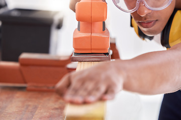 Image showing I need a smooth surface. a carpenter sanding a wood project.