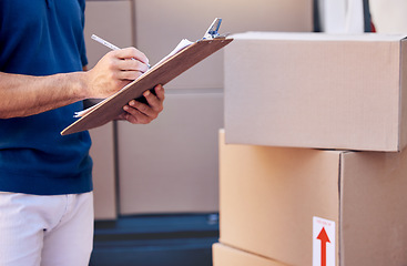 Image showing If you make a sale, you can make a living. a unrecognizable man using a clipboard while delivering outside.